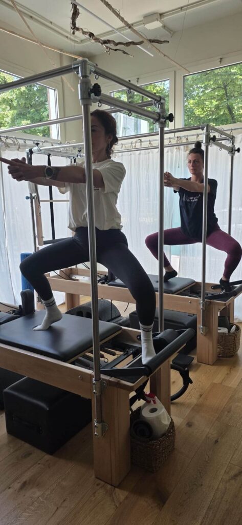 Lezione di gruppo su Reformer presso Respira Studio Pilates a Parma
